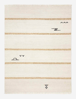 Iconic ivory stripe rug with thin, orange stripes and black small, modern symbols by Sarah Sherman Samuel