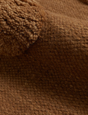 Close up of the Kohta high-low pile dot design wool area rug in camel