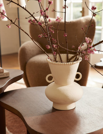 #color::buff #size::large | Philia wide beaded rim loop handle ceramic vase by Aimee Song styled on a coffee table