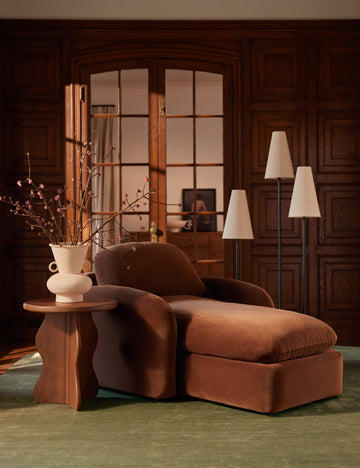 #color::black | Familia slim 3-tapered shade floor lamp by Aimee Song styled next to a chaise lounge chair