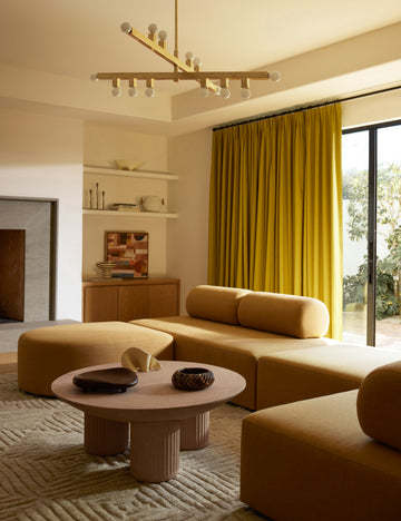 #color::terracotta | Living room featuring the Carr modern round fluted base coffee table.
