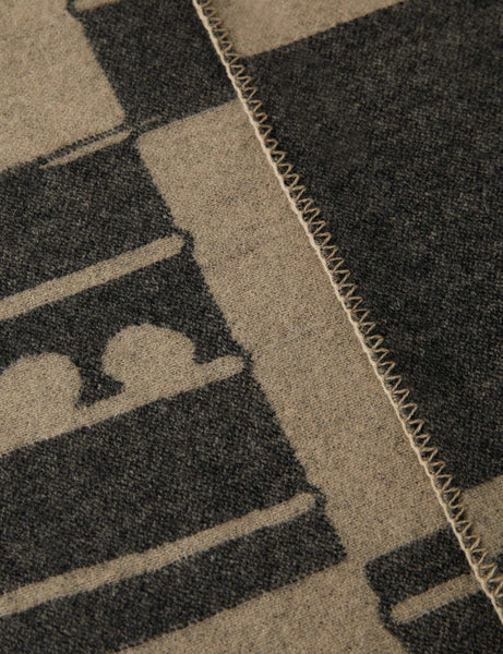 #color::black-and-beige | Close up view of the Checkered wool throw blanket in black and beige