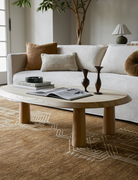 #color::natural | Living room featuring the Rodolfo organic oval natural wood coffee table and white sofa