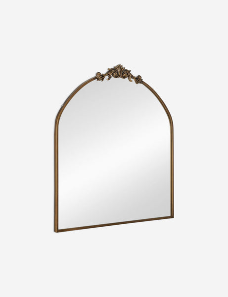#color::gold | Angled view of the Tulca arched gold mirror with flat bottom edge and traditional scroll detailing.