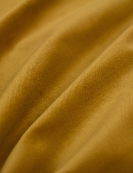 #color::citronella-velvet #size::twin #size::full #size::queen #size::king #size::cal-king | The Citronella Velvet fabric on the Deva platform bed