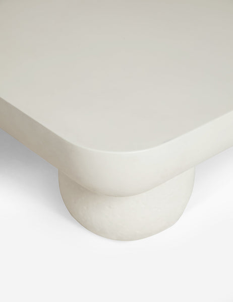| The rounded corner and leg on the Clouded square white coffee table