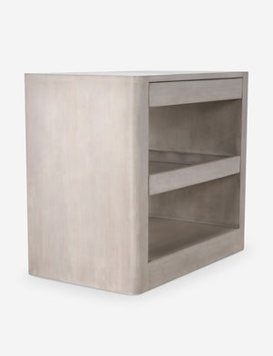 Angled view of the Arabel light wood open nightstand with two pull-out drawers