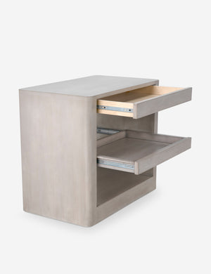 Angled view of the Arabel light wood open nightstand with its two pull-out drawers open