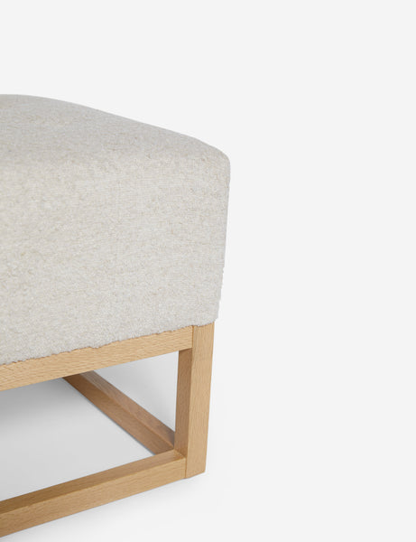 #color::taupe-boucle | Close up of the airy wooden frame on the bottom of the Grasmere Taupe Boucle Ottoman