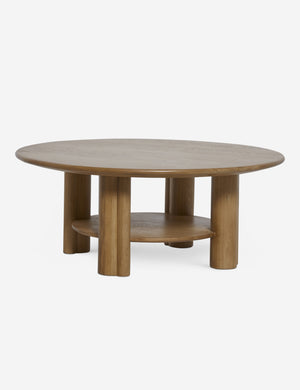 Jota round natural oak coffee table with shelf.