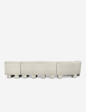 Rear view of the entire Lena left-facing white boucle sectional sofa with upholstered beam legs.