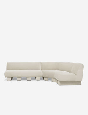 Lena right-facing white boucle sectional sofa with upholstered beam legs.