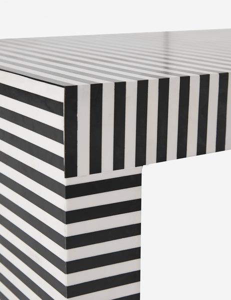 | Close up of where the leg and the base of the Prado black and white striped coffee table meet