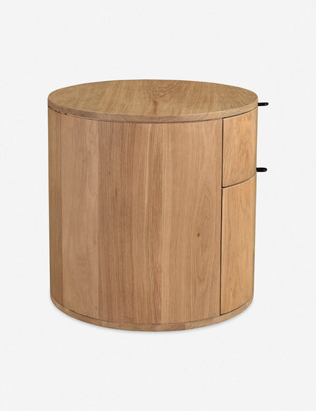 #color::natural | Side view of the Kono 2-drawer round oak nightstand.