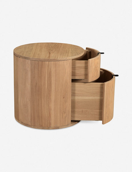 #color::natural | Side view of the Kono 2-drawer round oak nightstand with both drawers slightly opened.