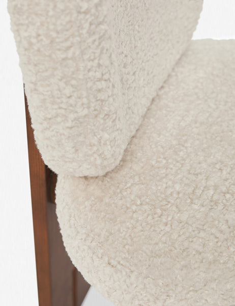 #color::cream-sherpa | Close up of the dual-paneled wooden backing on the Sydney Dining Chair (Set of 2) where the back and seat cushion meet