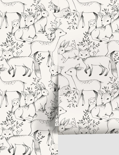 | Ivory Woodland Wallpaper with black deer, fox, owl, and rabbit designs by Rylee + Cru