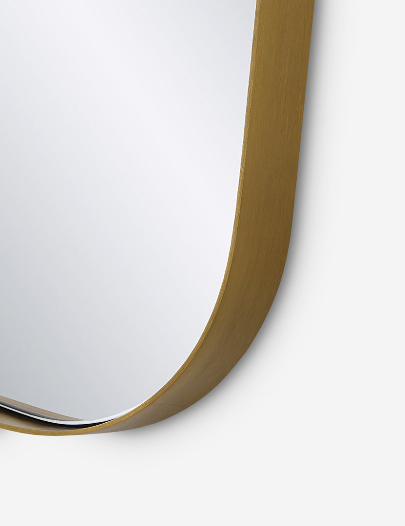 #color::gold | Close up view of the Belvoir thin brass framed wall mirror