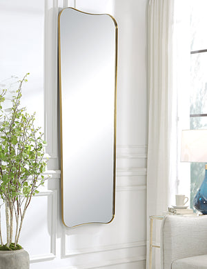 Belvoir metal framed full length mirror in gold hanging on the wall