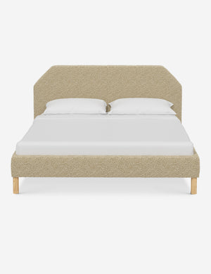 Kipp Buff Boucle upholstered platform bed with a geometric headboard and pinewood legs