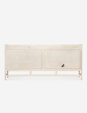 Rear view of the Philene natural mango wood sideboard with cane doors