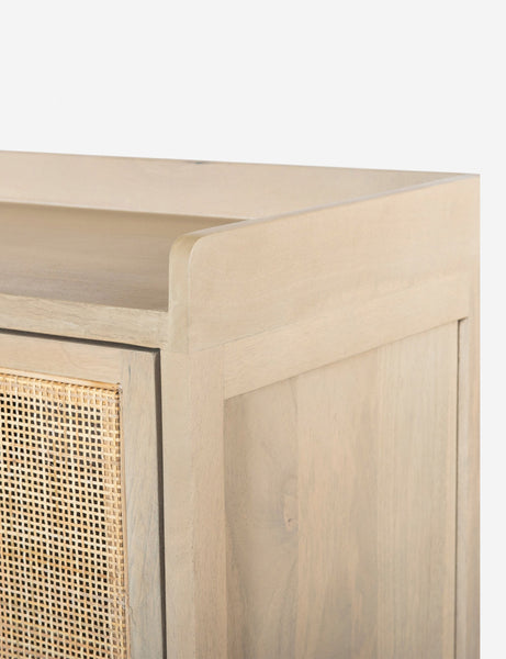 #color::natural | Close-up of the walled exterior surface of the Philene natural mango wood sideboard with cane doors