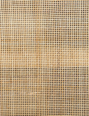 Detailed view of the woven cane on the doors of the Philene natural mango wood sideboard