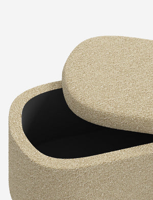 Beige textured fabric ottoman with flat top and short wooden legs.