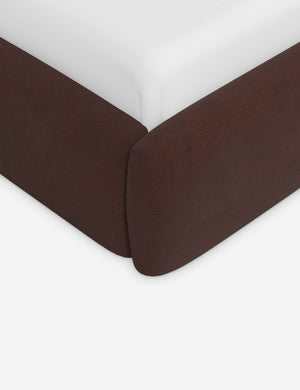 Corner of the Gladys extended headboard upholstered platform bed in wine corduroy
