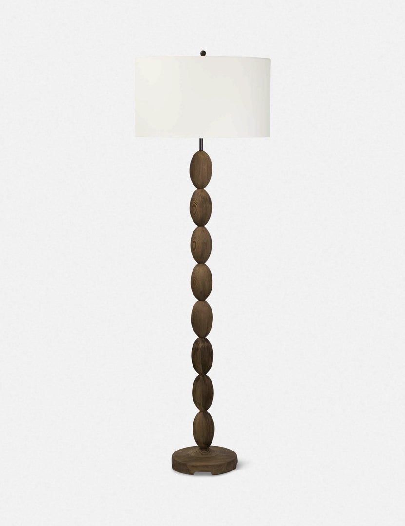 | Coastal living buoy floor lamp with brass hardware and a natural linen shade by regina andrew