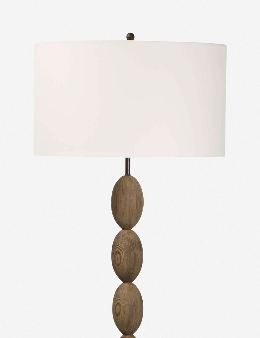 | Close-up of the natural linen shade on the Coastal living buoy floor lamp with brass hardware by regina andrew