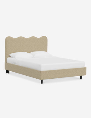 Angled view of Clementine buff boucle platform bed with undulating lined headboard