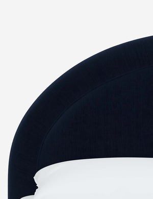 Close-up of the welted headboard on the Odele navy Velvet bed