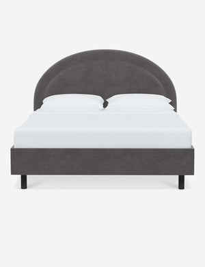 Odele Steel Gray Velvet upholstered bed with an arched headboard that has a welted border