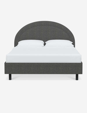 Odele Charcoal Gray Linen upholstered bed with an arched headboard that has a welted border
