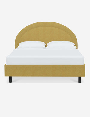 Odele Golden Linen upholstered bed with an arched headboard that has a welted border