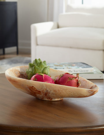 #color::orange | Jonty marble decorative bowl styled on a coffee table filled with fruits.