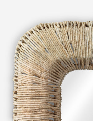 Close up of the Raelyn coastal woven frame wall mirror.