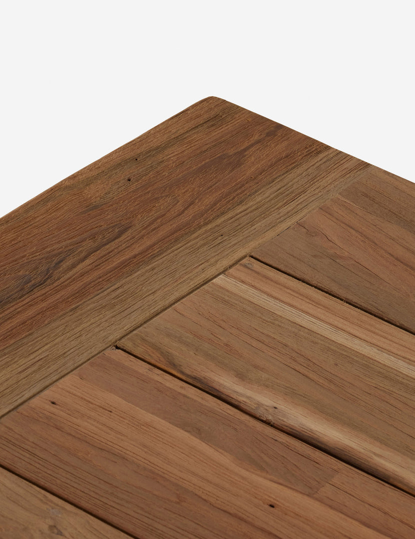 #color::natural | Close up view of the Oveido reclaimed teak outdoor dining table.