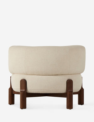 Rear view of the Furst sculptural upholstered barrel back accent chair in ivory.