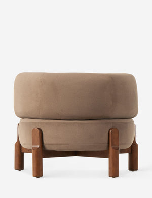 Rear view of the Furst sculptural upholstered barrel back accent chair in taupe velvet.