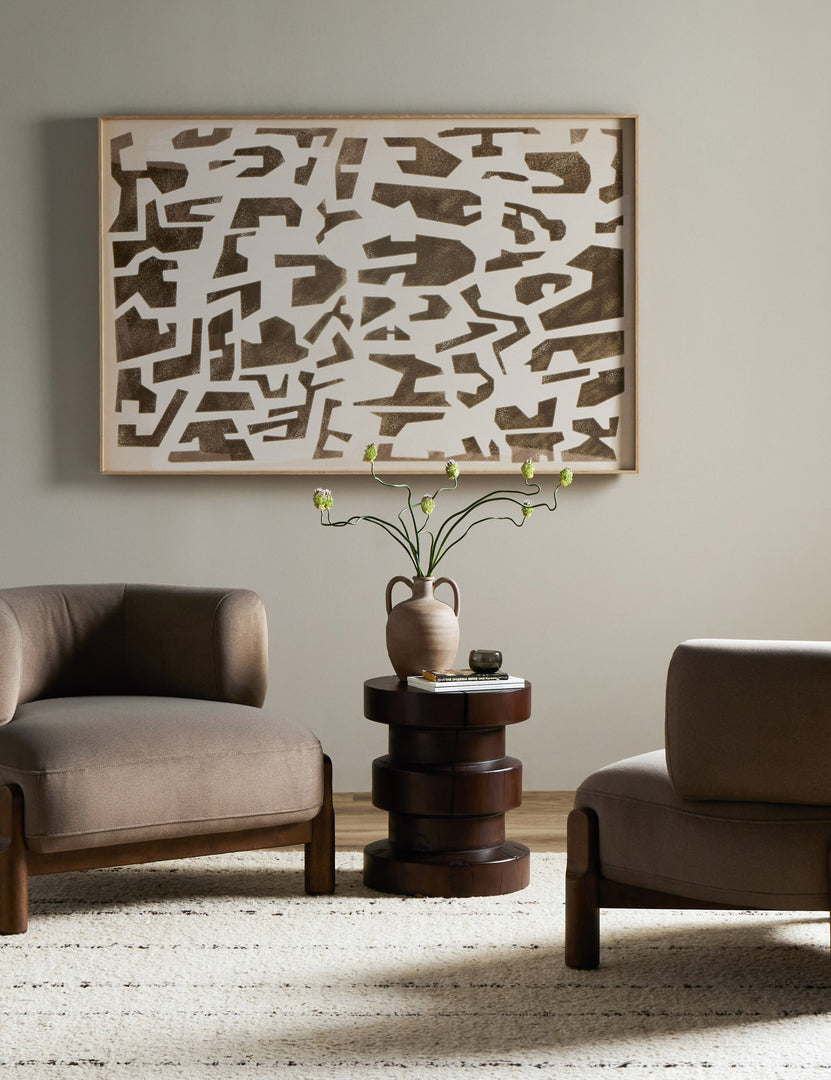 #color::taupe-velvet | Two of the Furst sculptural upholstered barrel back accent chair in taupe velvet styled with a round side table and modern wall art.
