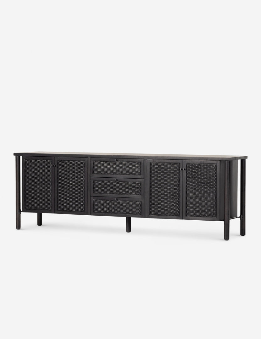 #color::black | Angled view of the Isaura black cane-paneled media console.