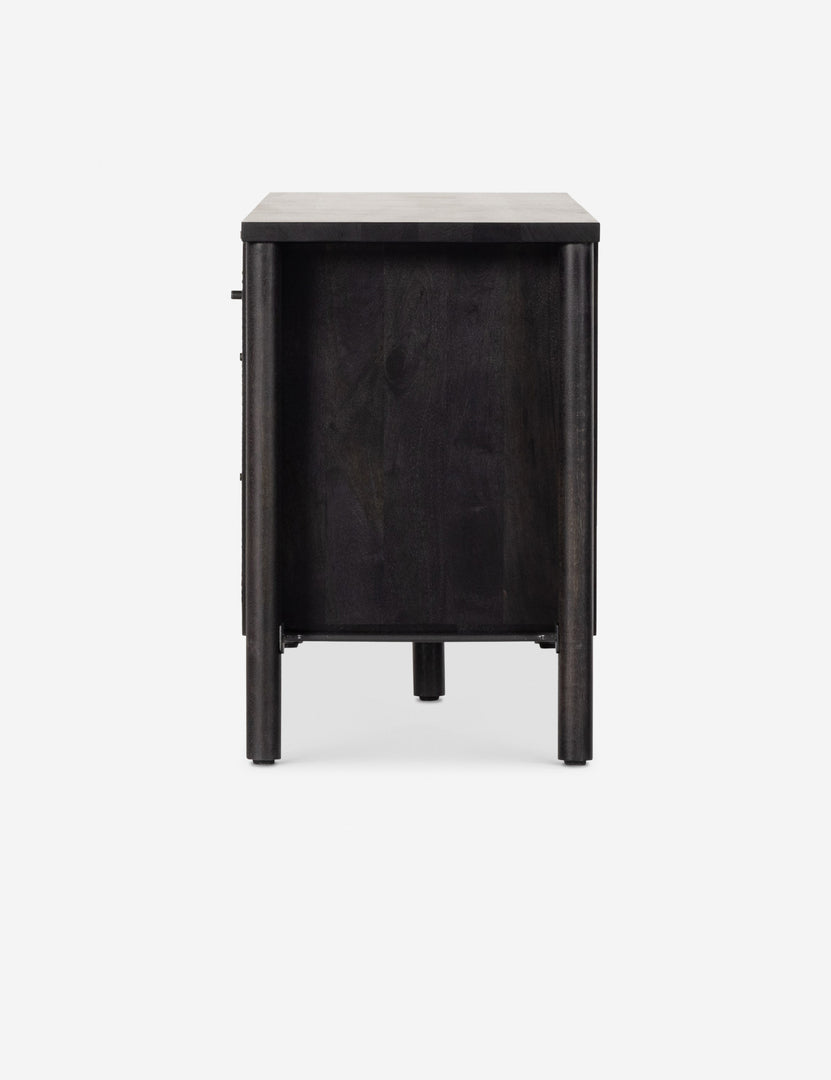 #color::black | Side view of the Isaura black cane-paneled media console.