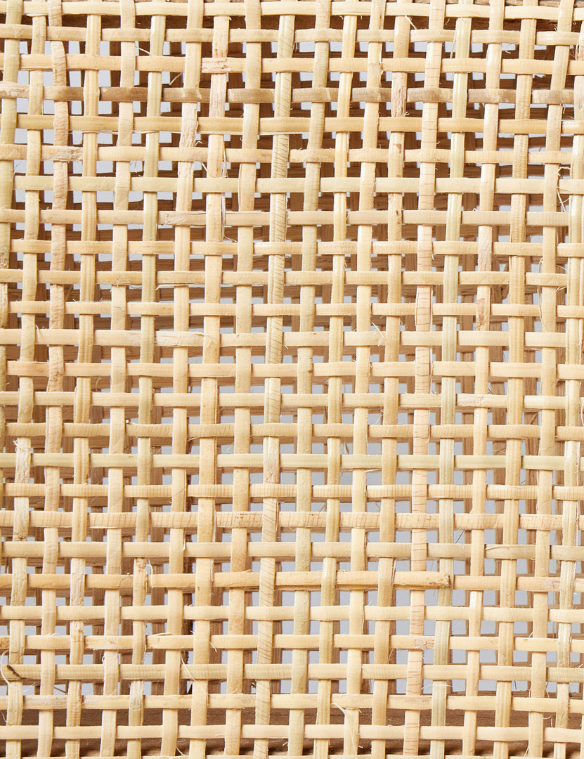 #color::natural | Detailed view of the cane material of the Kairi dining chair.
