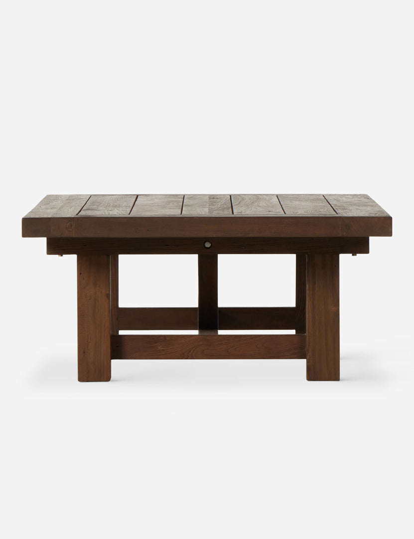 | Side view of the Kirkman solid teak rustic wood outdoor coffee table.