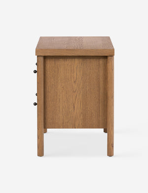 Side profile of the Kisner natural grain oak nightstand.