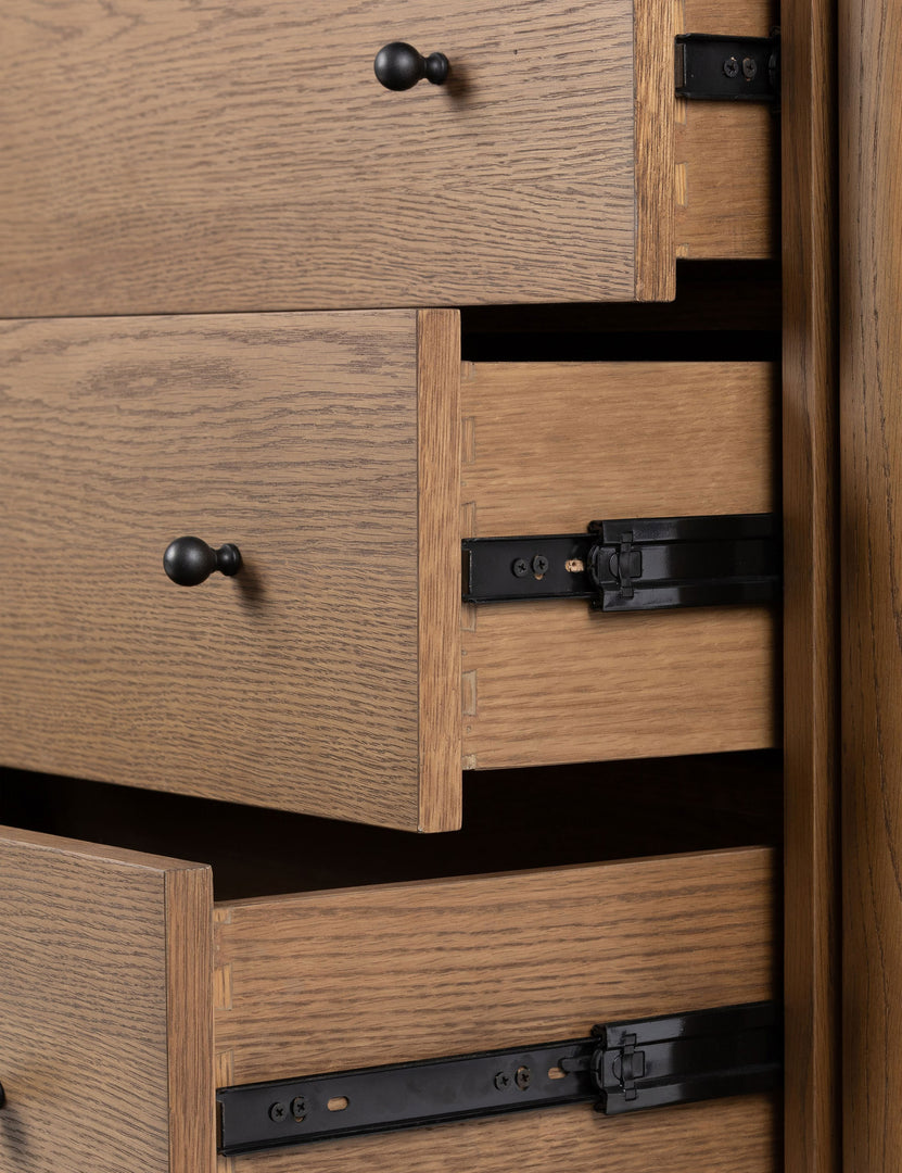 #color::natural | Close up view of the drawers of the Kisner natural grain oak dresser.