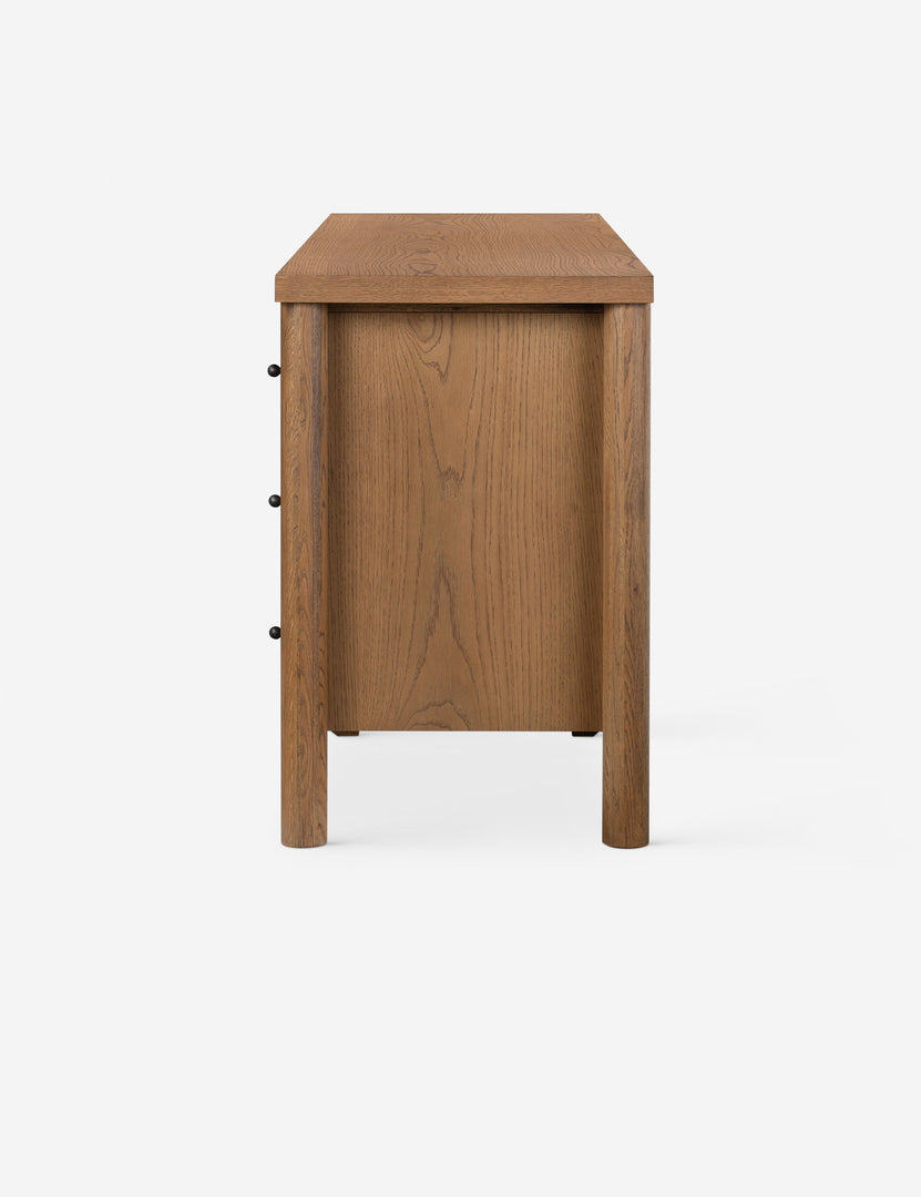 #color::natural | Side profile of the Kisner natural grain oak dresser.