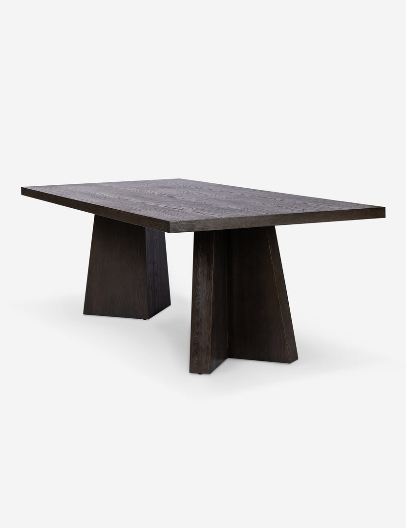 #color::brown | Angled view of the Hallen angular leg sculptural dining table.